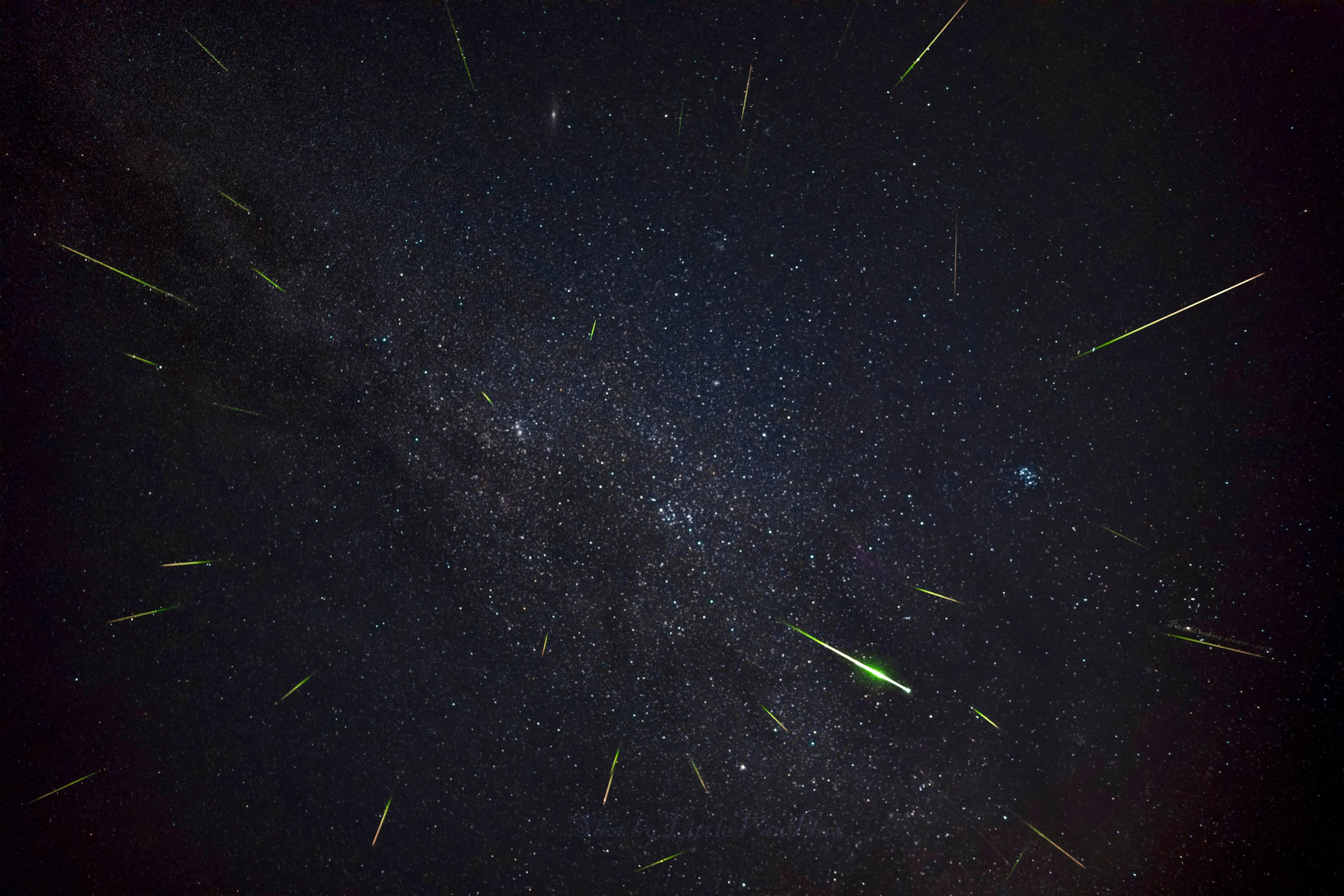 Stacked meteors with a bright green fireball